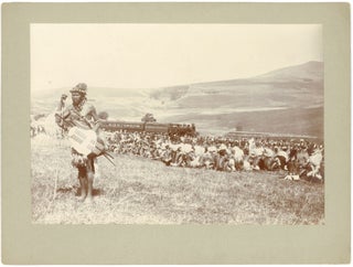 ZULU CEREMONIAL GATHERING WITH TRAIN IN BACKGROUND, NATAL, SOUTH AFRICA — ca. 1895–1905
